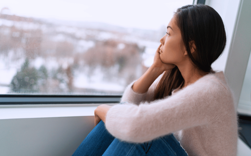 Woman sulking at bench